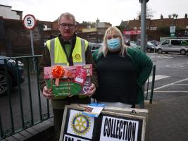 President Julian receiving a donation of 138 mince pies from Mel at Morrisons 